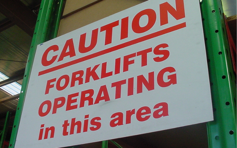Forklift operating in warehouse sign
